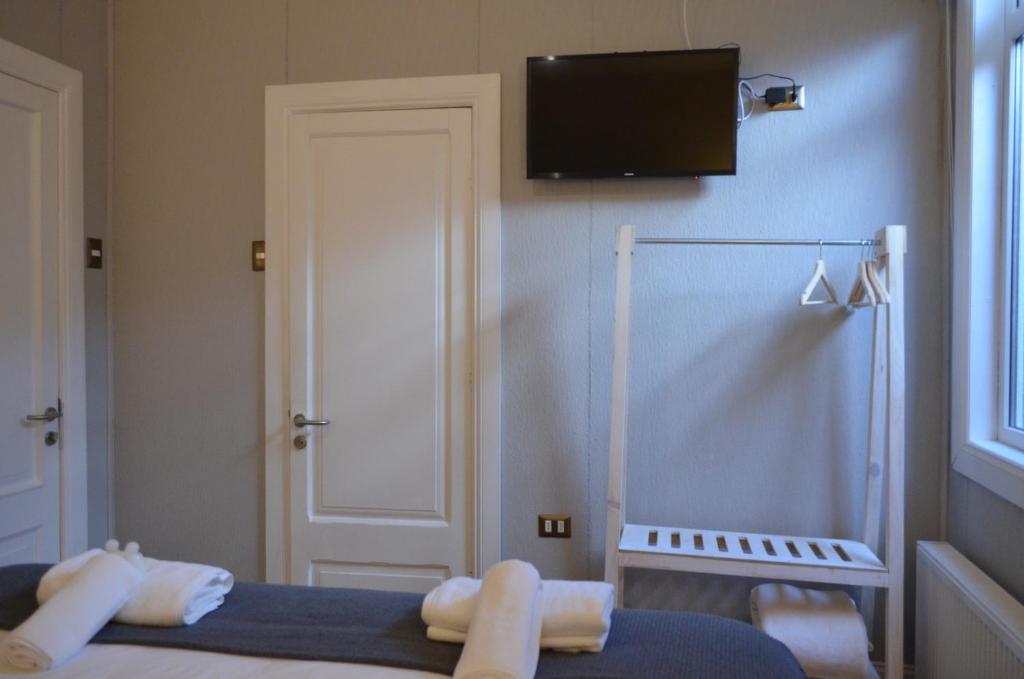 Postel nebo postele na pokoji v ubytování Hostal Boutique Puerta Roja