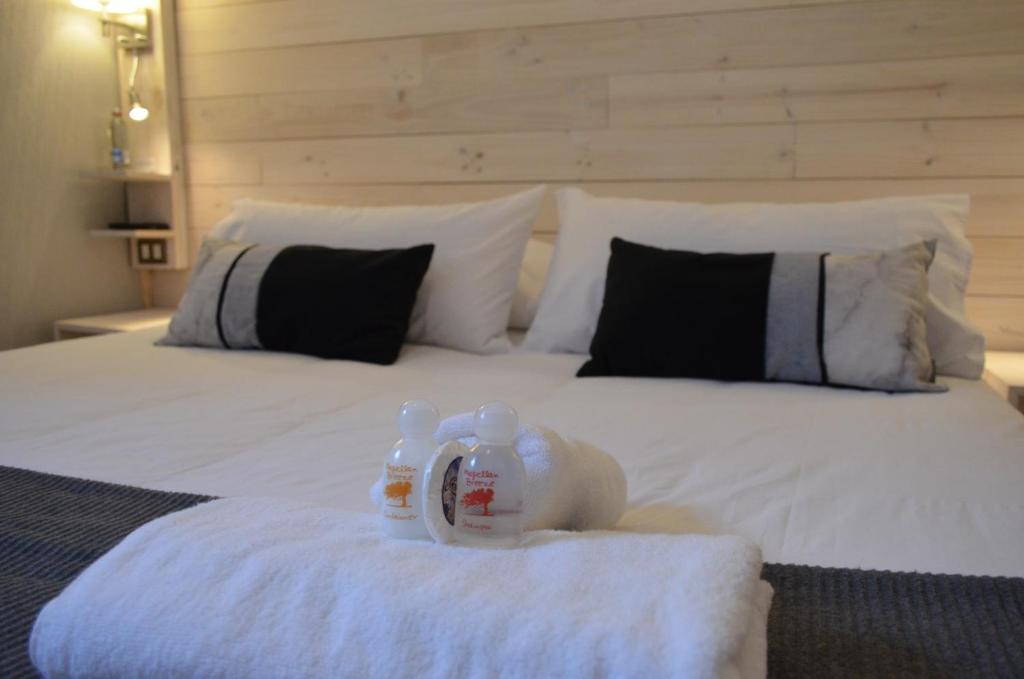 Postel nebo postele na pokoji v ubytování Hostal Boutique Puerta Roja
