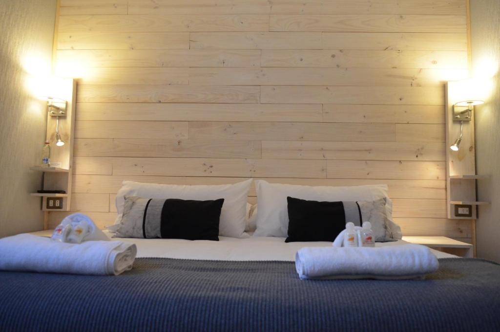 Postel nebo postele na pokoji v ubytování Hostal Boutique Puerta Roja