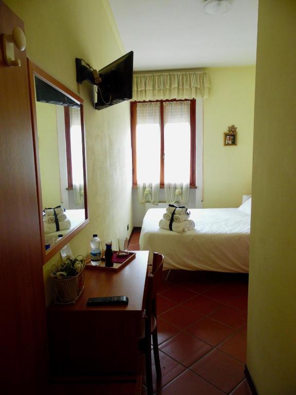 Postel nebo postele na pokoji v ubytování Al Borgo