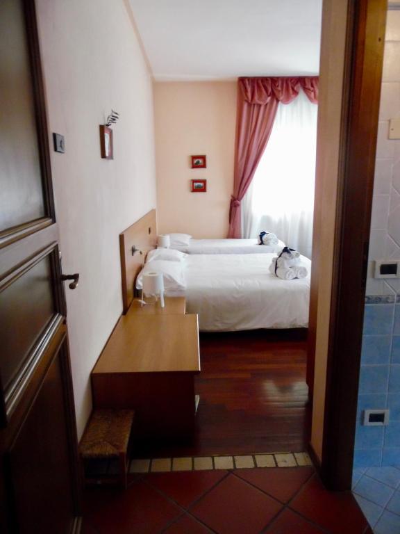 Postel nebo postele na pokoji v ubytování Al Borgo