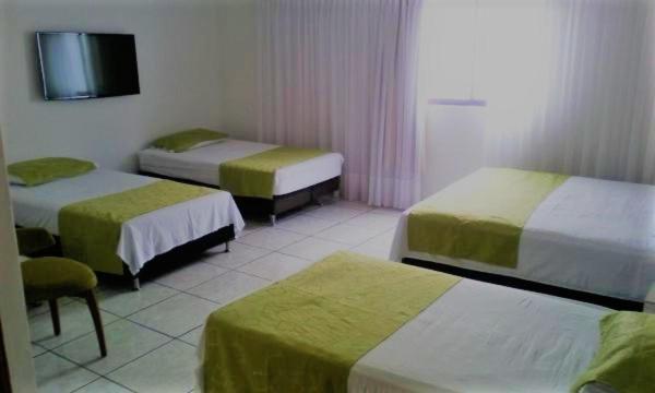 Postel nebo postele na pokoji v ubytování Hotel Florida Inn