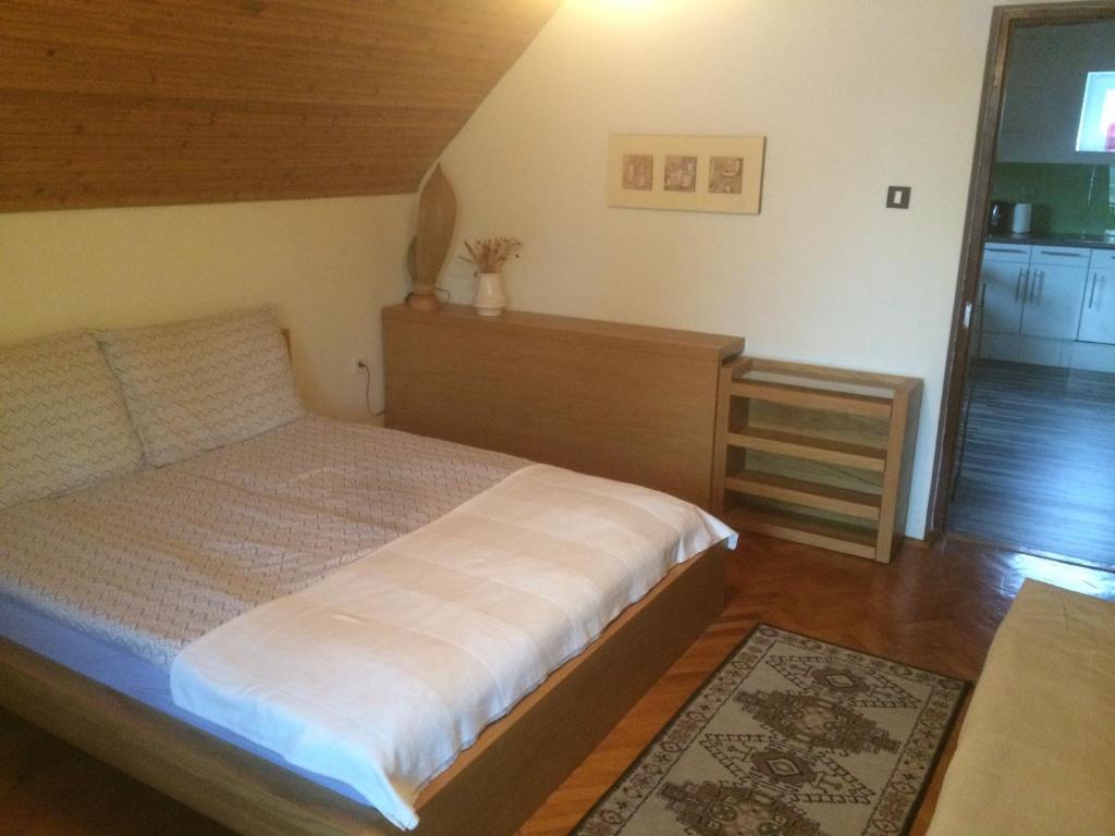 Posteľ alebo postele v izbe v ubytovaní Apartman Luca