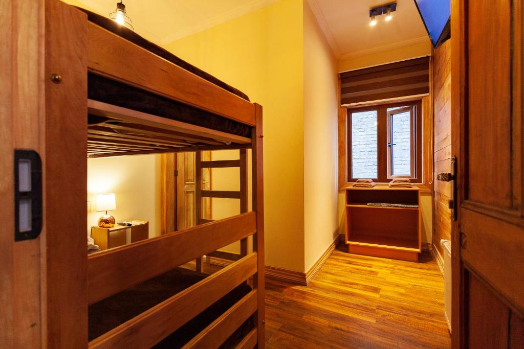Postel nebo postele na pokoji v ubytování Hostal Boutique Patagonia Mística