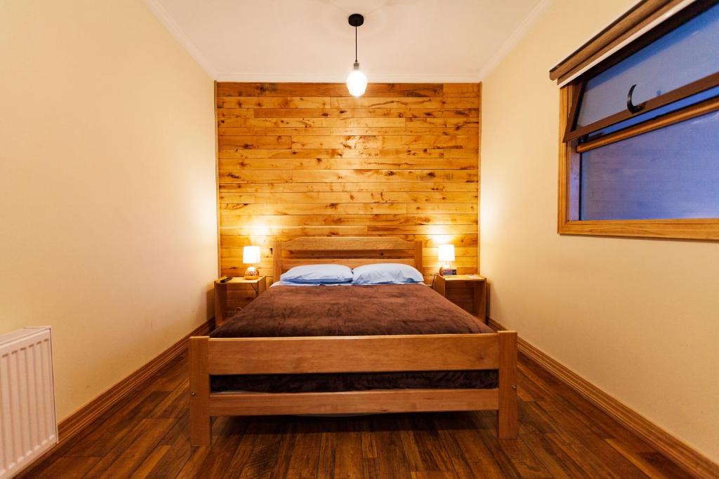Postel nebo postele na pokoji v ubytování Hostal Boutique Patagonia Mística