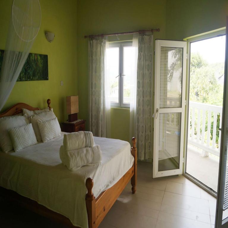 Postel nebo postele na pokoji v ubytování A Private Room in Paradise, Vieux Fort