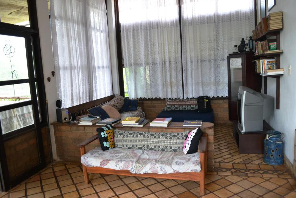 Uma área de estar em Pousada Alto do Cajueiro