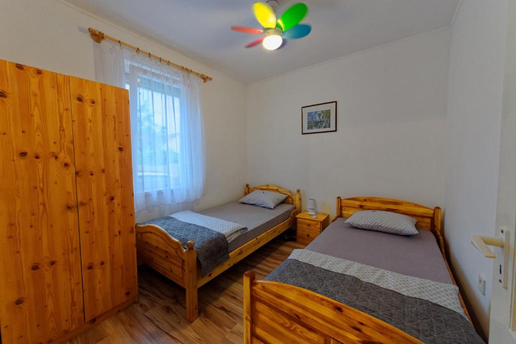 Posteľ alebo postele v izbe v ubytovaní Zsoryka Vendégház