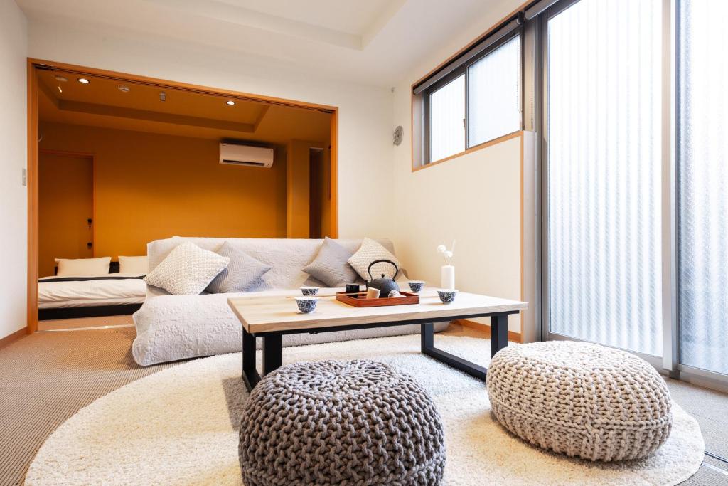 a living room with a couch and a table at 宿坊 正伝寺 Temple hotel Shoden-ji in Tokyo