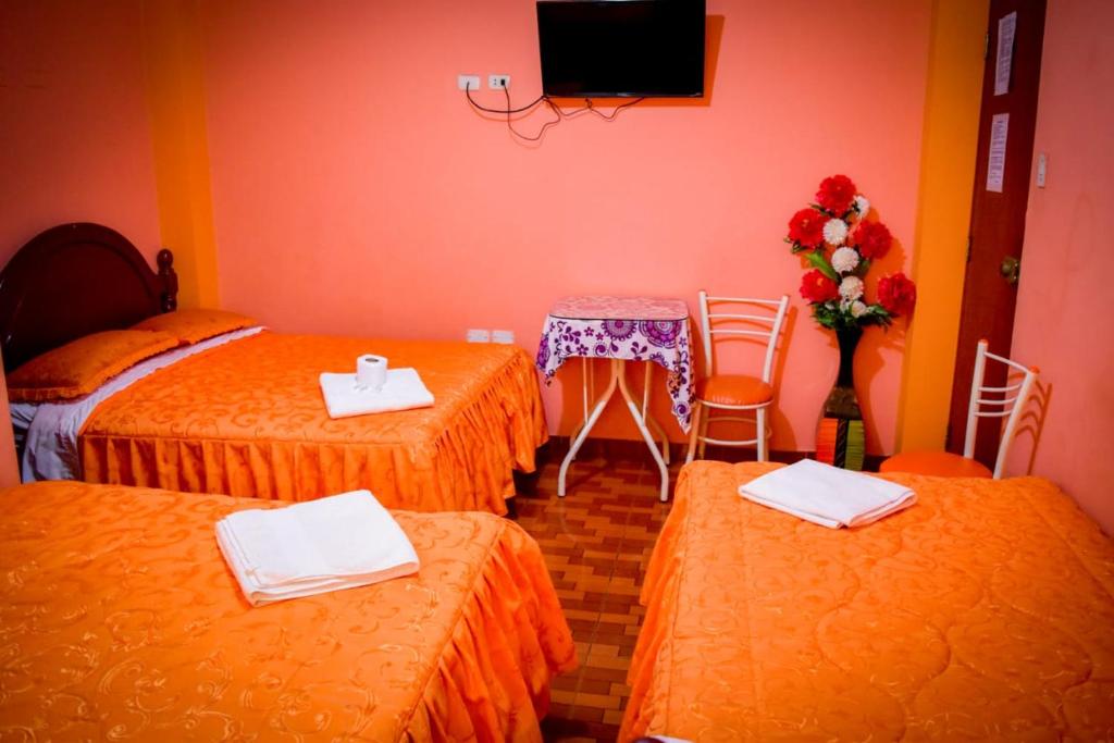 Postel nebo postele na pokoji v ubytování Hospedaje San Pedro Tacna