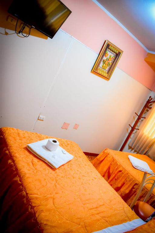 Postel nebo postele na pokoji v ubytování Hospedaje San Pedro Tacna