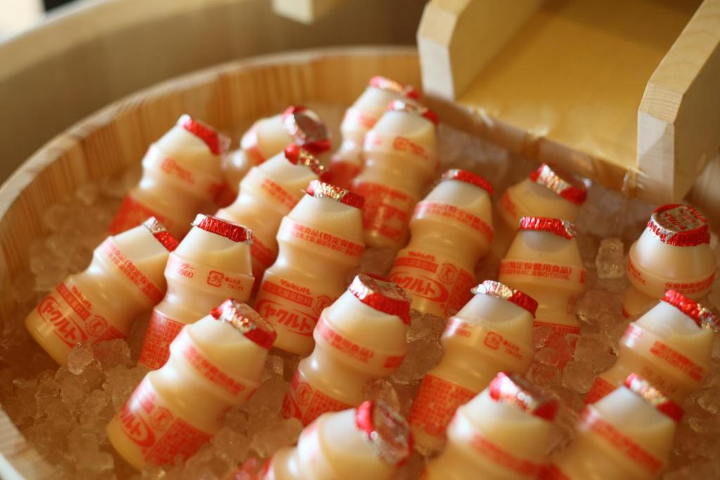 a bunch of marshmallows in a wooden bowl at Takayama Ouan in Takayama