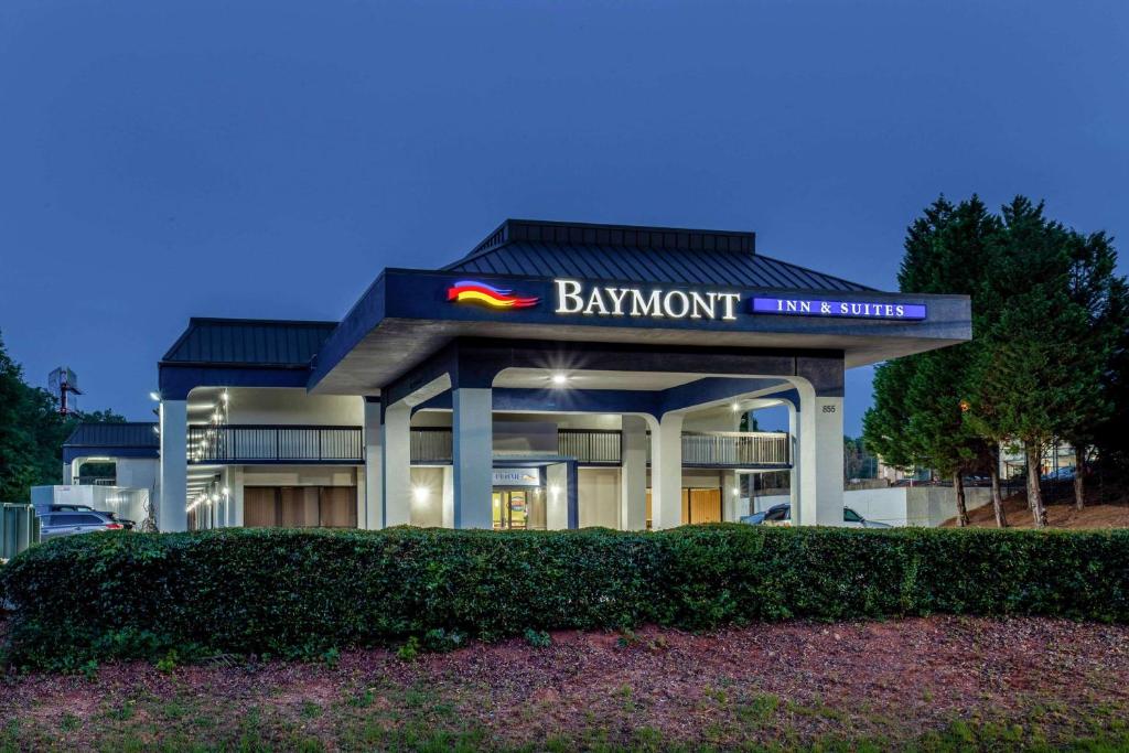 a building with a bmw sign in front of it at Baymont by Wyndham McDonough in McDonough