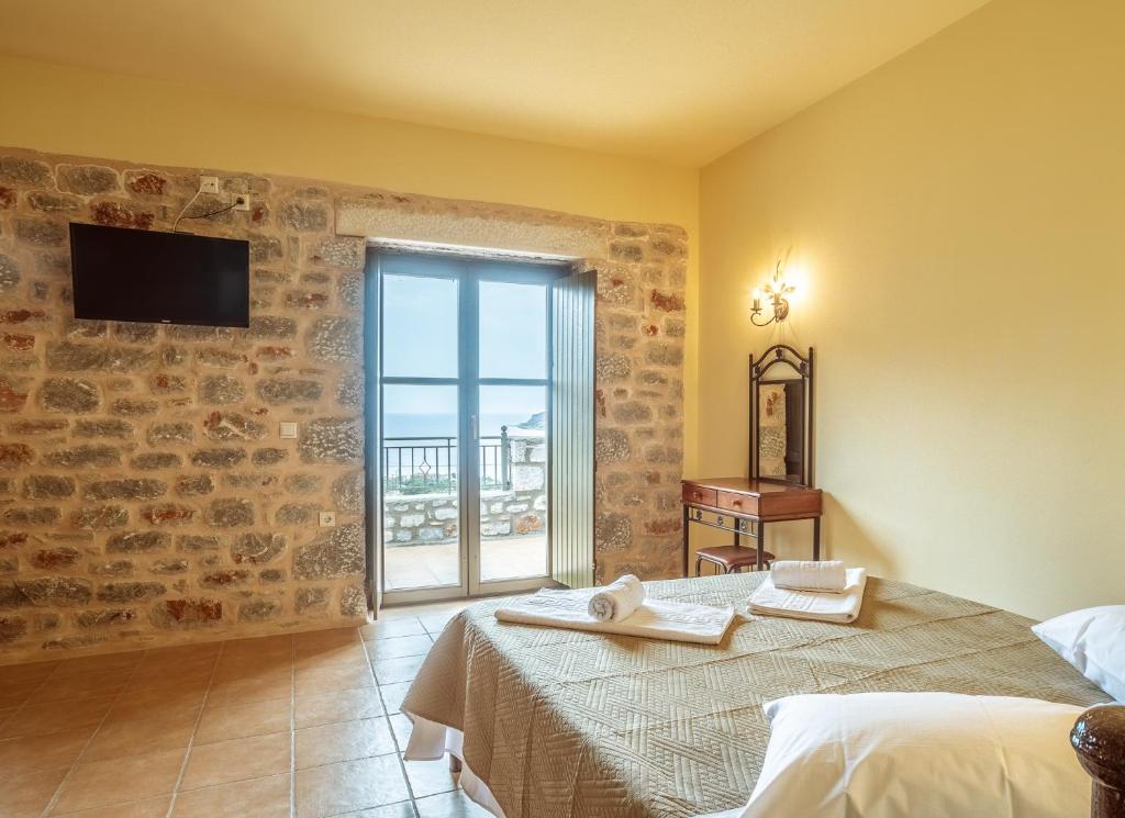 Postel nebo postele na pokoji v ubytování Onar Mani Suites