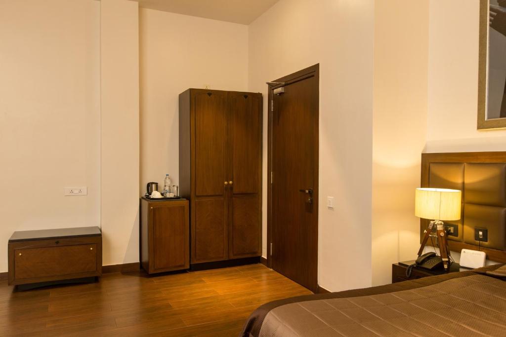 Postel nebo postele na pokoji v ubytování Park Suites