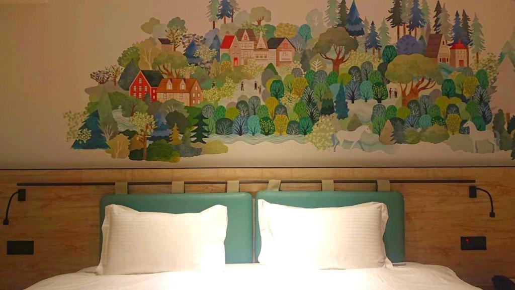Postel nebo postele na pokoji v ubytování JSL hotel