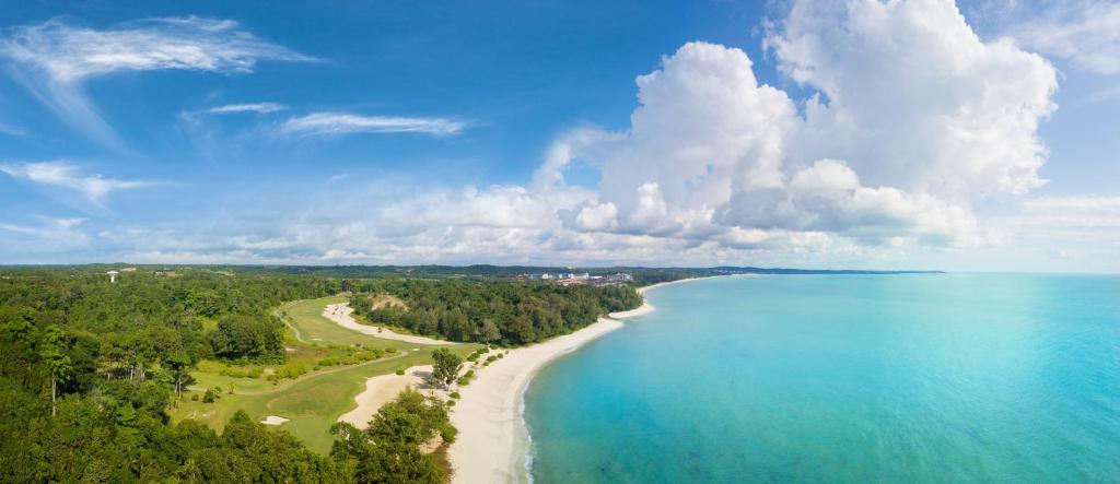 an aerial view of a beach and the ocean at Anantara Desaru Coast Resort & Villas in Desaru