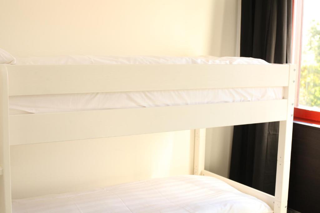 Postel nebo postele na pokoji v ubytování Nacka Stadshotell