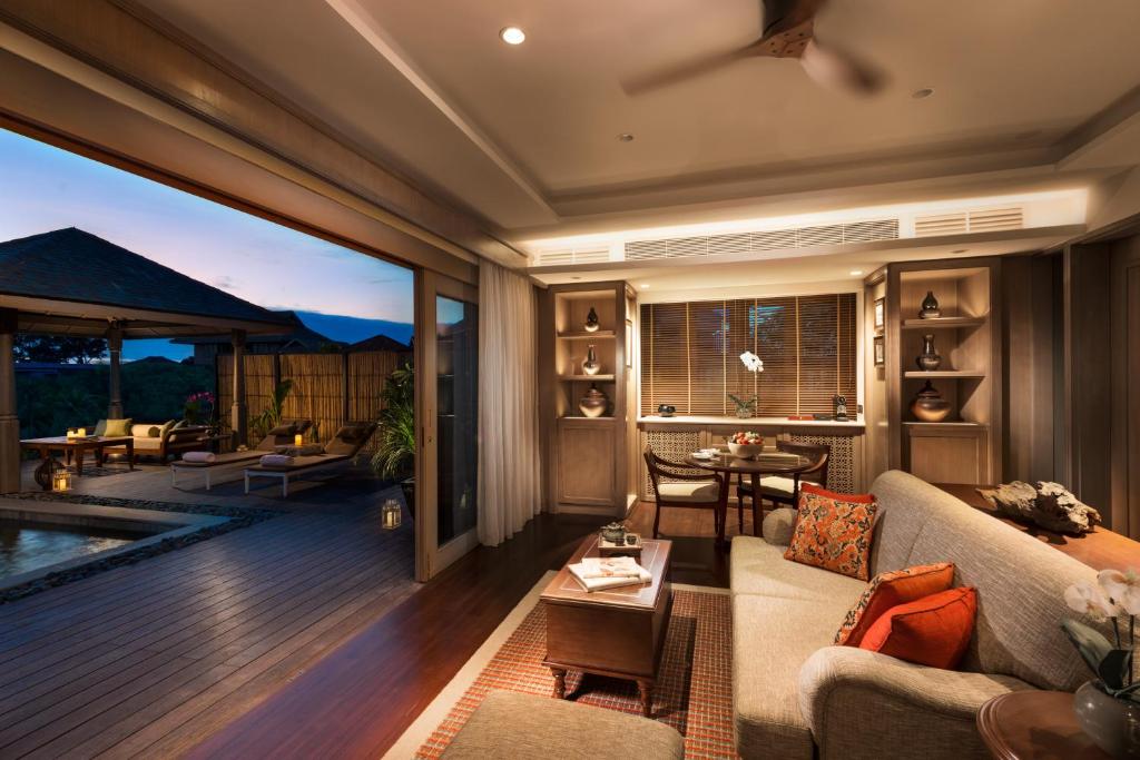a living room with a couch and a table at Anantara Desaru Coast Resort & Villas in Desaru