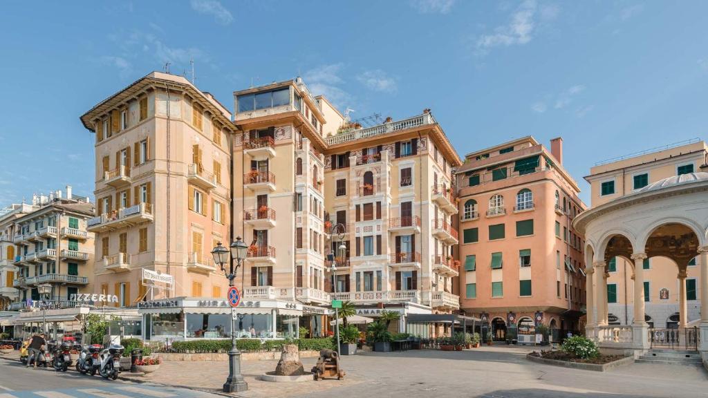a group of buildings on a city street at Miramare Hotel in Rapallo