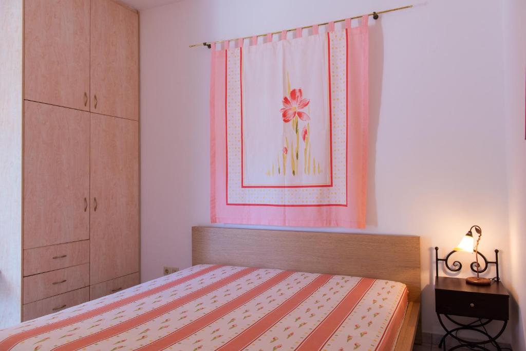 Postel nebo postele na pokoji v ubytování Arhontou