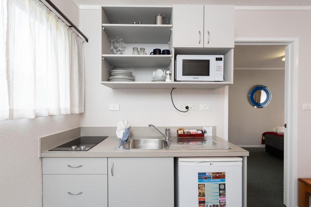 Kuchyň nebo kuchyňský kout v ubytování Edelweiss Motel