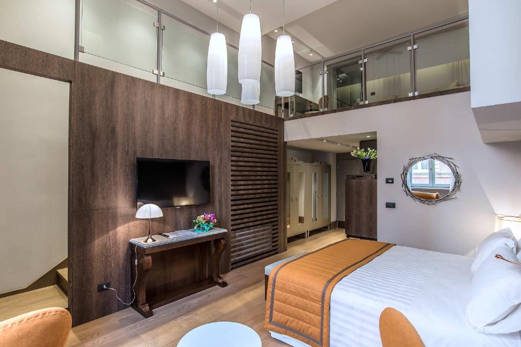 Postel nebo postele na pokoji v ubytování Hotel Martis Palace