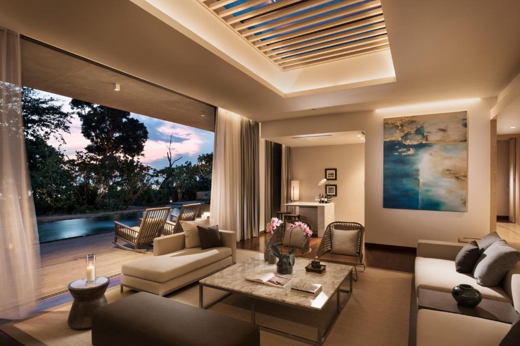 a living room with a couch and a table at Anantara Desaru Coast Resort & Villas in Desaru