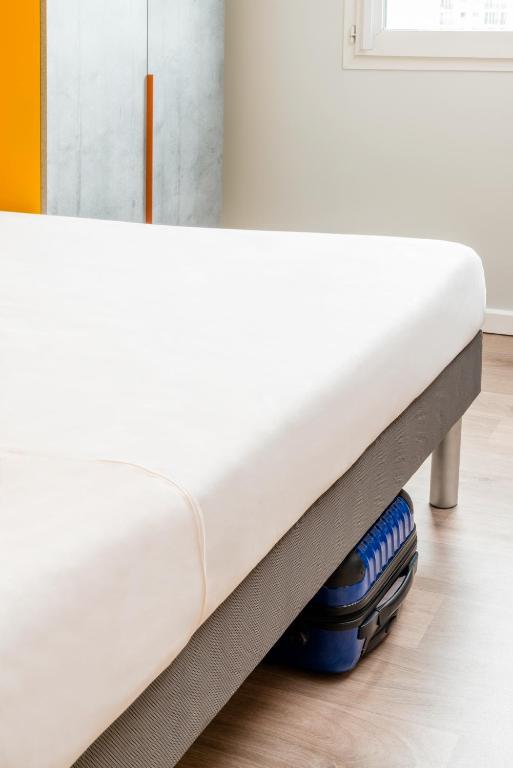 Postel nebo postele na pokoji v ubytování ibis budget Lyon Est Beynost