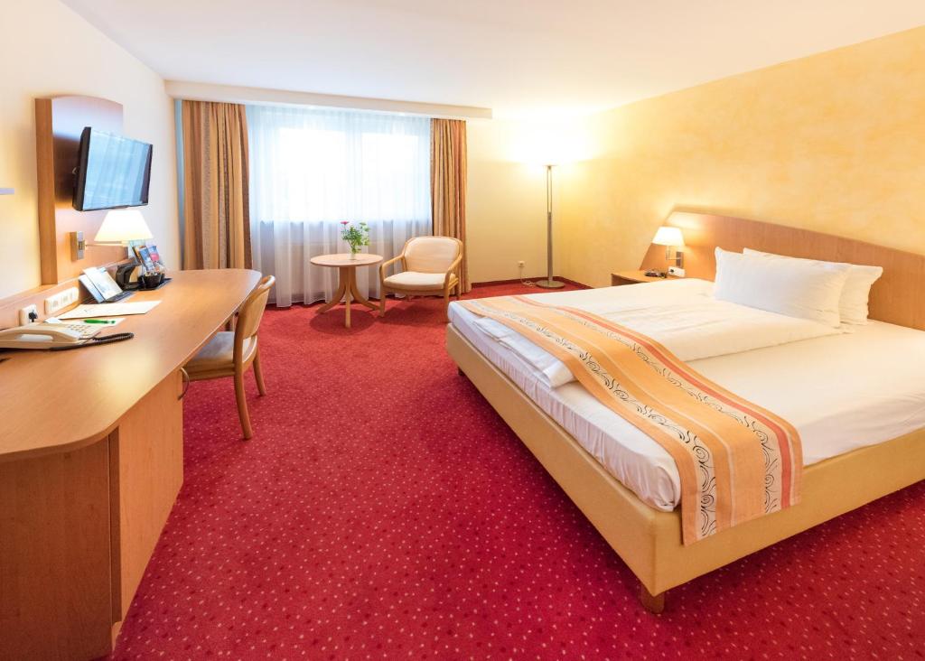 Postel nebo postele na pokoji v ubytování Hotel Alarun