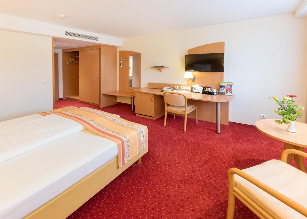 Postel nebo postele na pokoji v ubytování Hotel Alarun