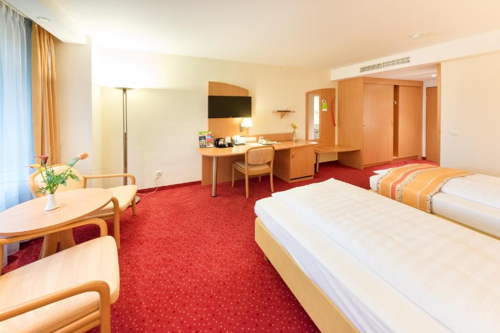 Postel nebo postele na pokoji v ubytování Hotel Alarun