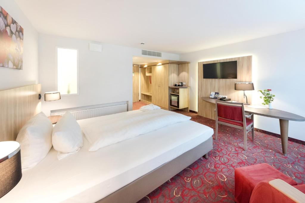 Postel nebo postele na pokoji v ubytování Hotel Alarun
