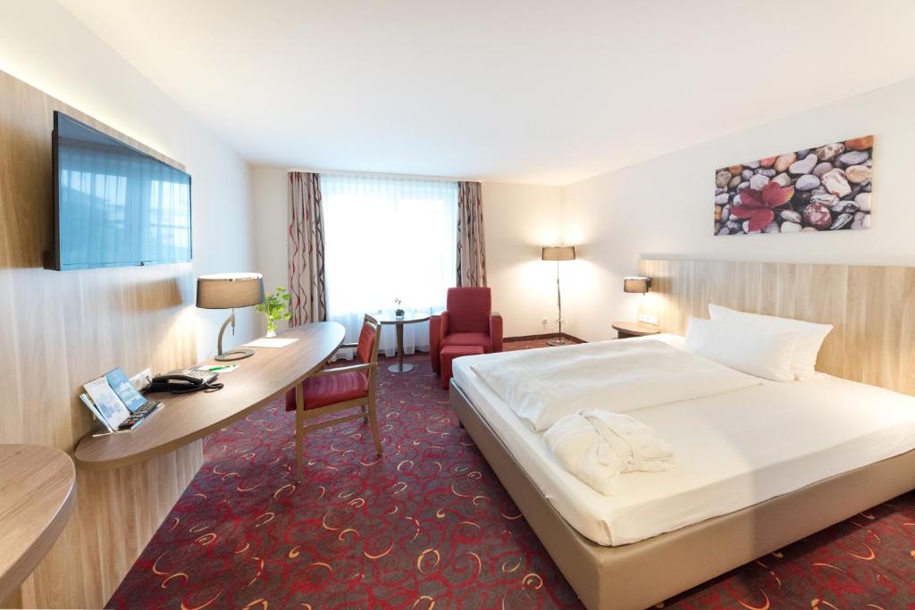 Postel nebo postele na pokoji v ubytování Hotel Alarun