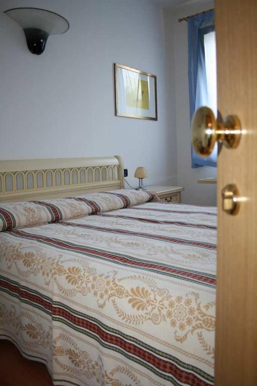 Postel nebo postele na pokoji v ubytování Hotel Ristorante La Rua