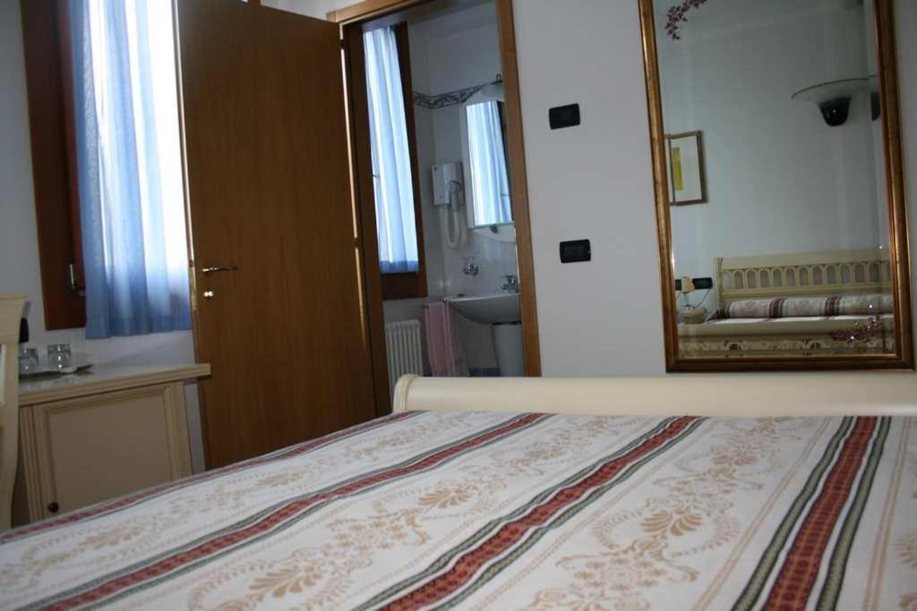 Postel nebo postele na pokoji v ubytování Hotel Ristorante La Rua
