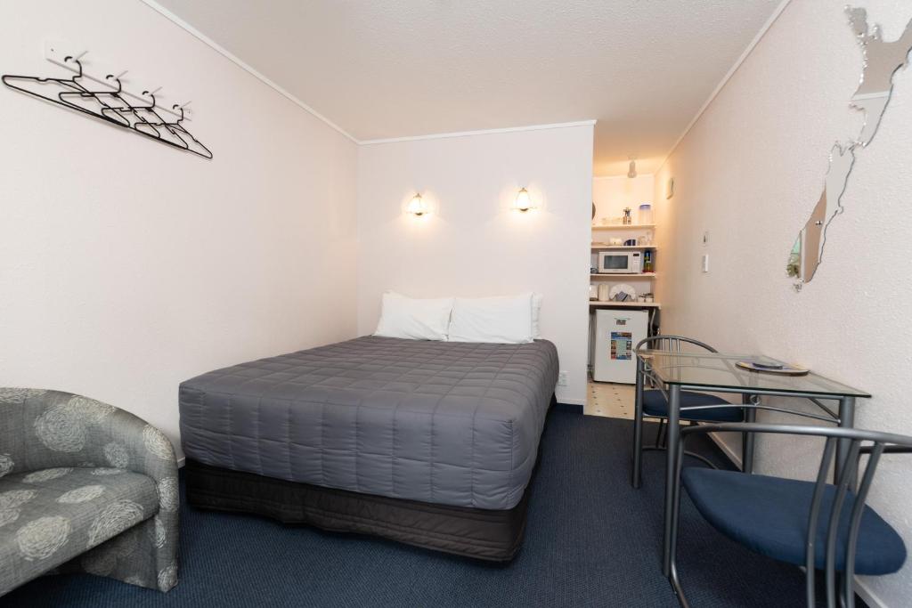 Postel nebo postele na pokoji v ubytování Edelweiss Motel