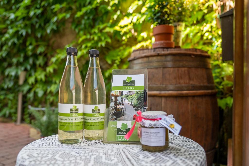 two bottles of wine sitting on top of a table at Laubgassl in Mörbisch am See