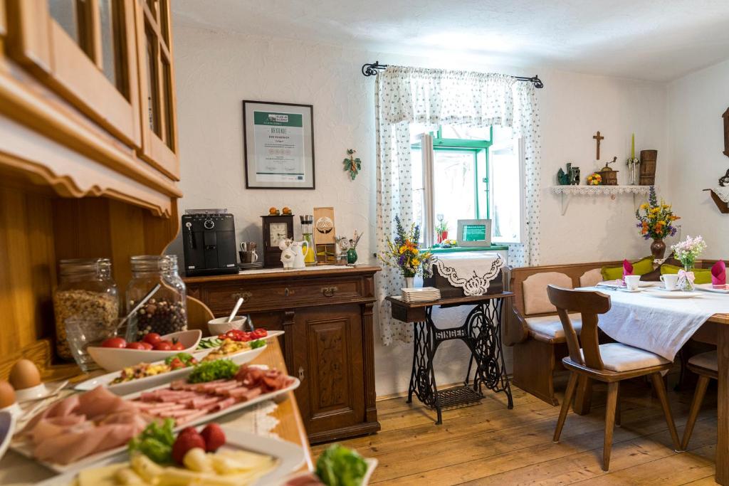 a kitchen with a table with food on it at Laubgassl in Mörbisch am See