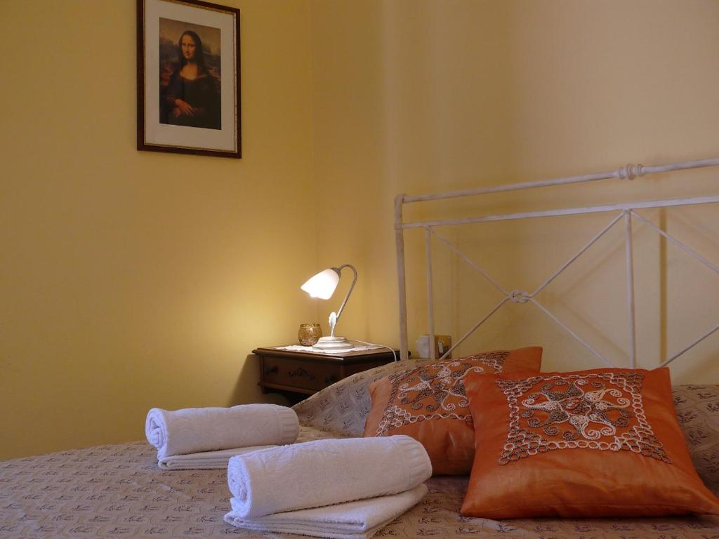 Postel nebo postele na pokoji v ubytování Antica Bottega di Vinci