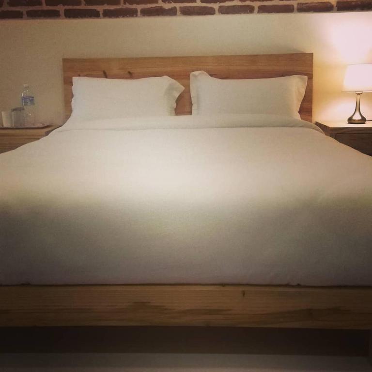 Postel nebo postele na pokoji v ubytování Sayami Home