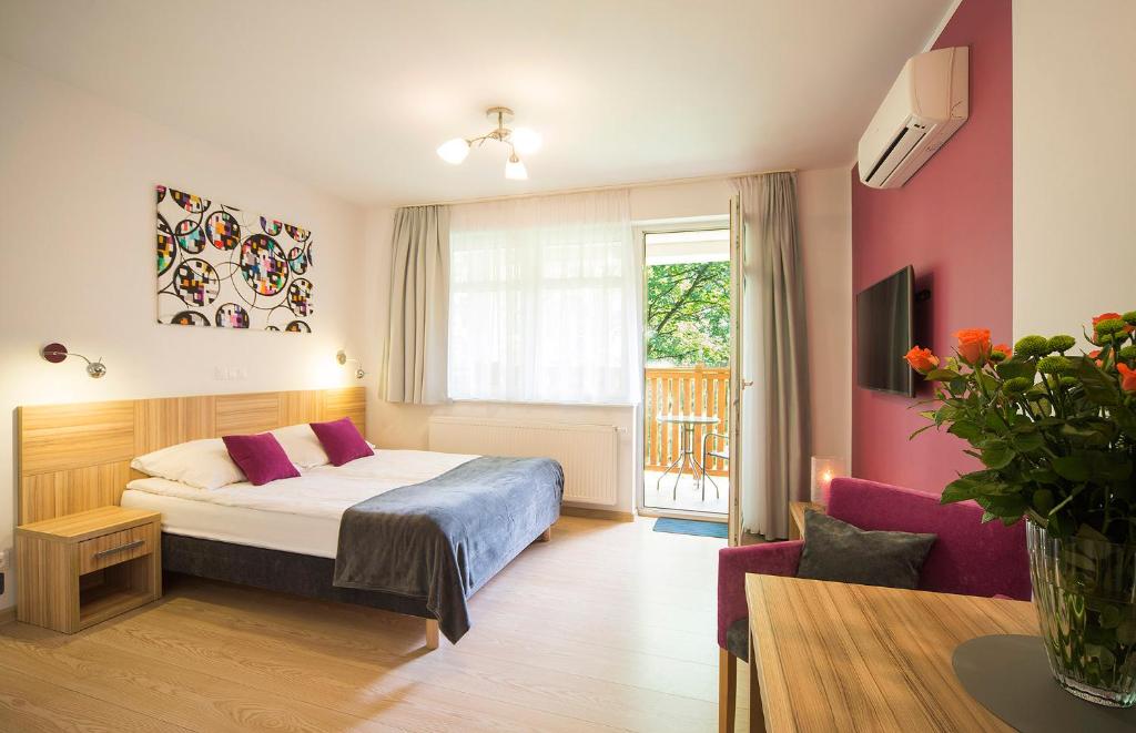 Postel nebo postele na pokoji v ubytování Malina Apartamenty