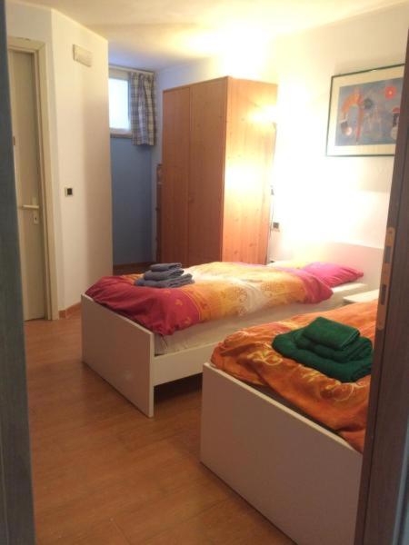 A bed or beds in a room at DaCapo Rooms