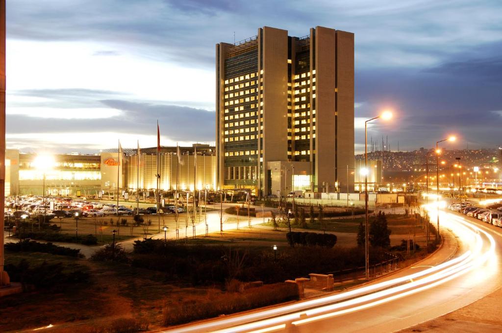 a city street at night with tall buildings at CPAnkara Hotel in Ankara