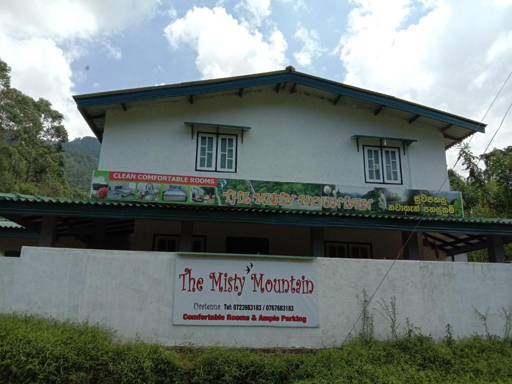 a building with a sign in front of it at The Misty Mountain Guest House in Haldummulla