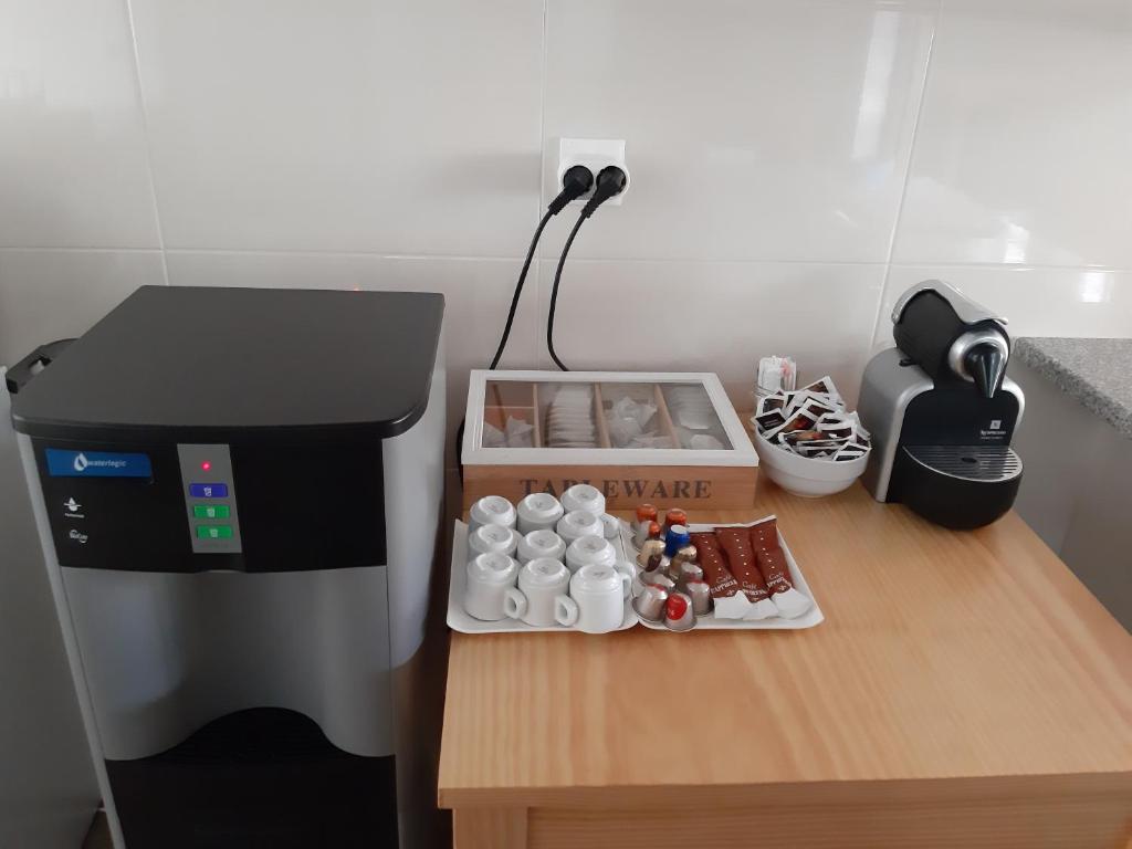 Kuchyň nebo kuchyňský kout v ubytování Hostel Criativo do Sabugueiro