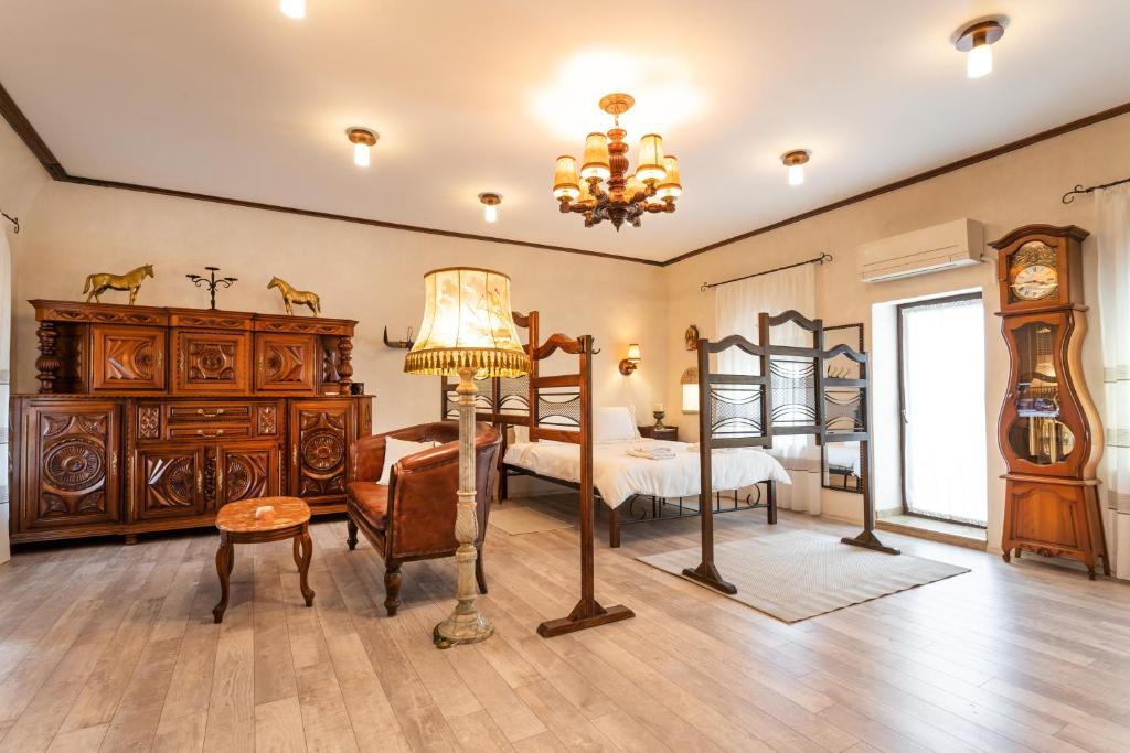 a bedroom with two bunk beds and a bed with a clock at Historic Apartment in the heart of the City in Veliko Tŭrnovo