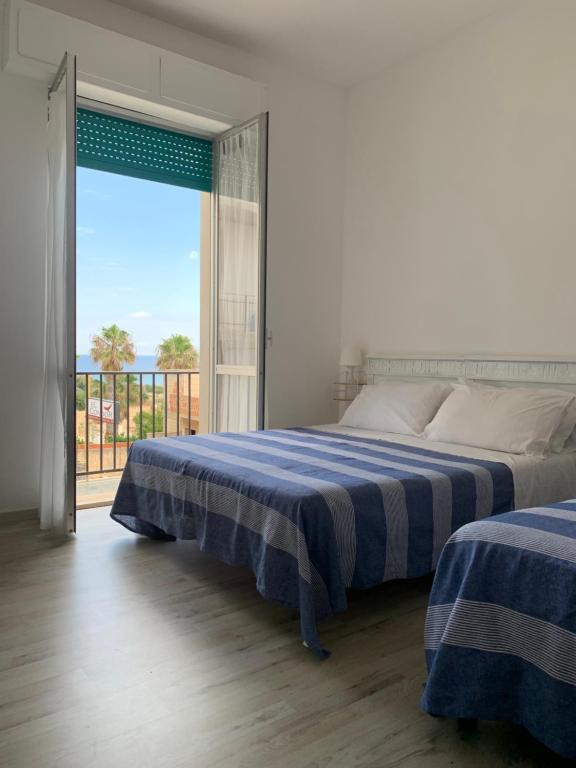 Postel nebo postele na pokoji v ubytování B&B Giallolumia