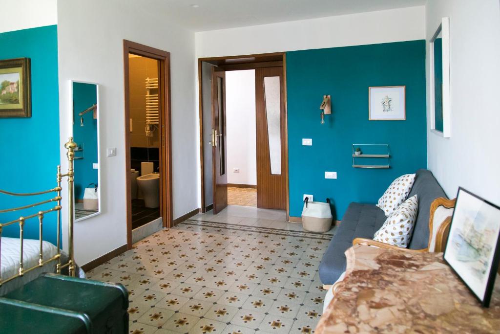 Łóżko lub łóżka w pokoju w obiekcie A Casa di Nina Guest House