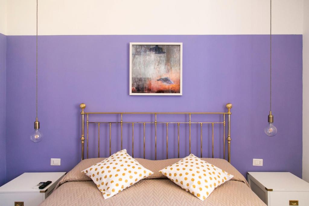Łóżko lub łóżka w pokoju w obiekcie A Casa di Nina Guest House